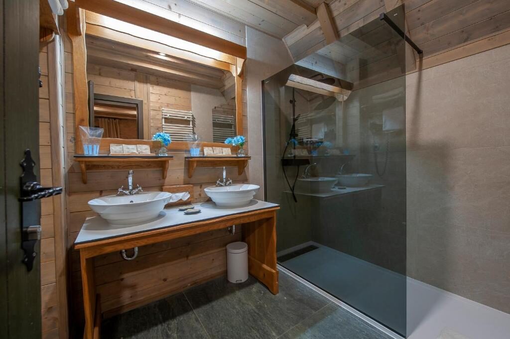 Bathroom with a walk-in shower and wooden vanity